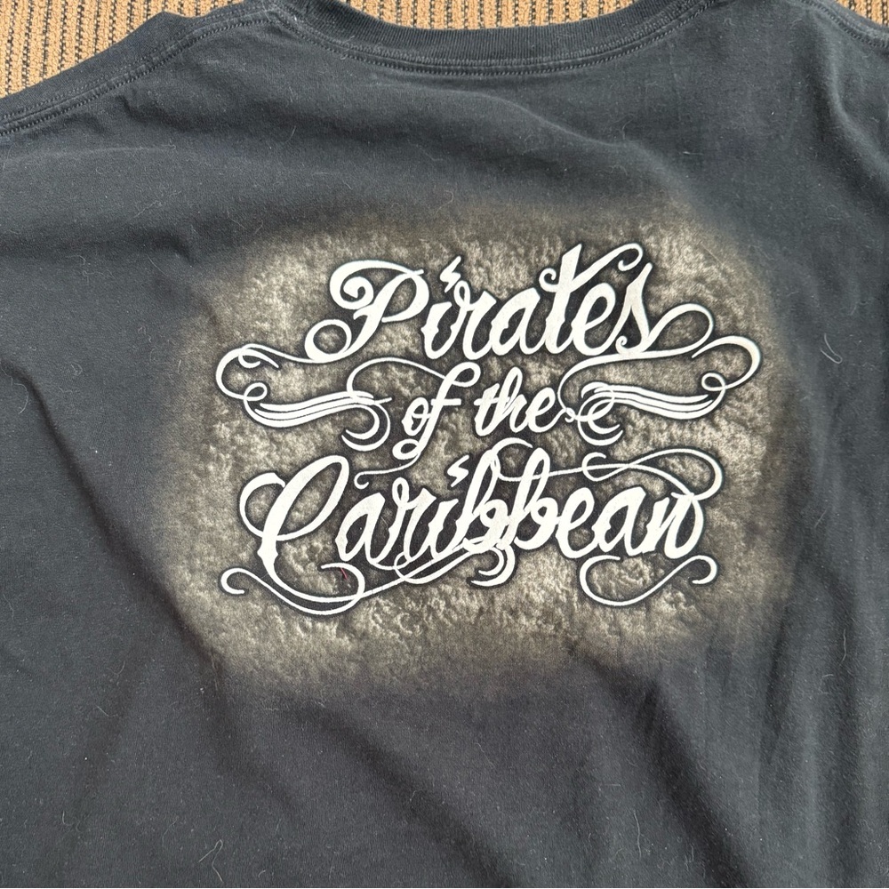Black Pirates of the Caribbean shirt.